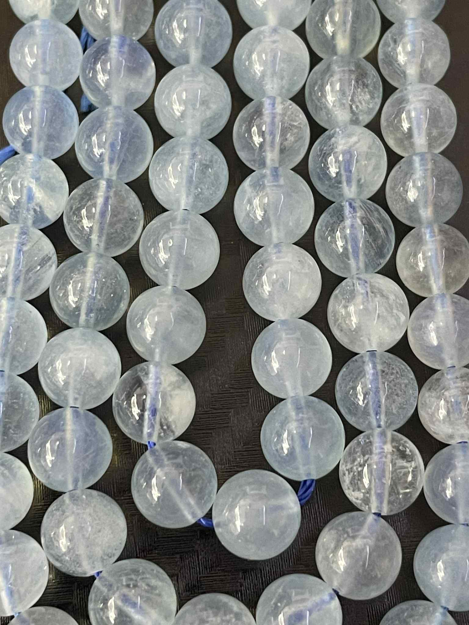 Aquamarin ca. 7mm Kugelstrang