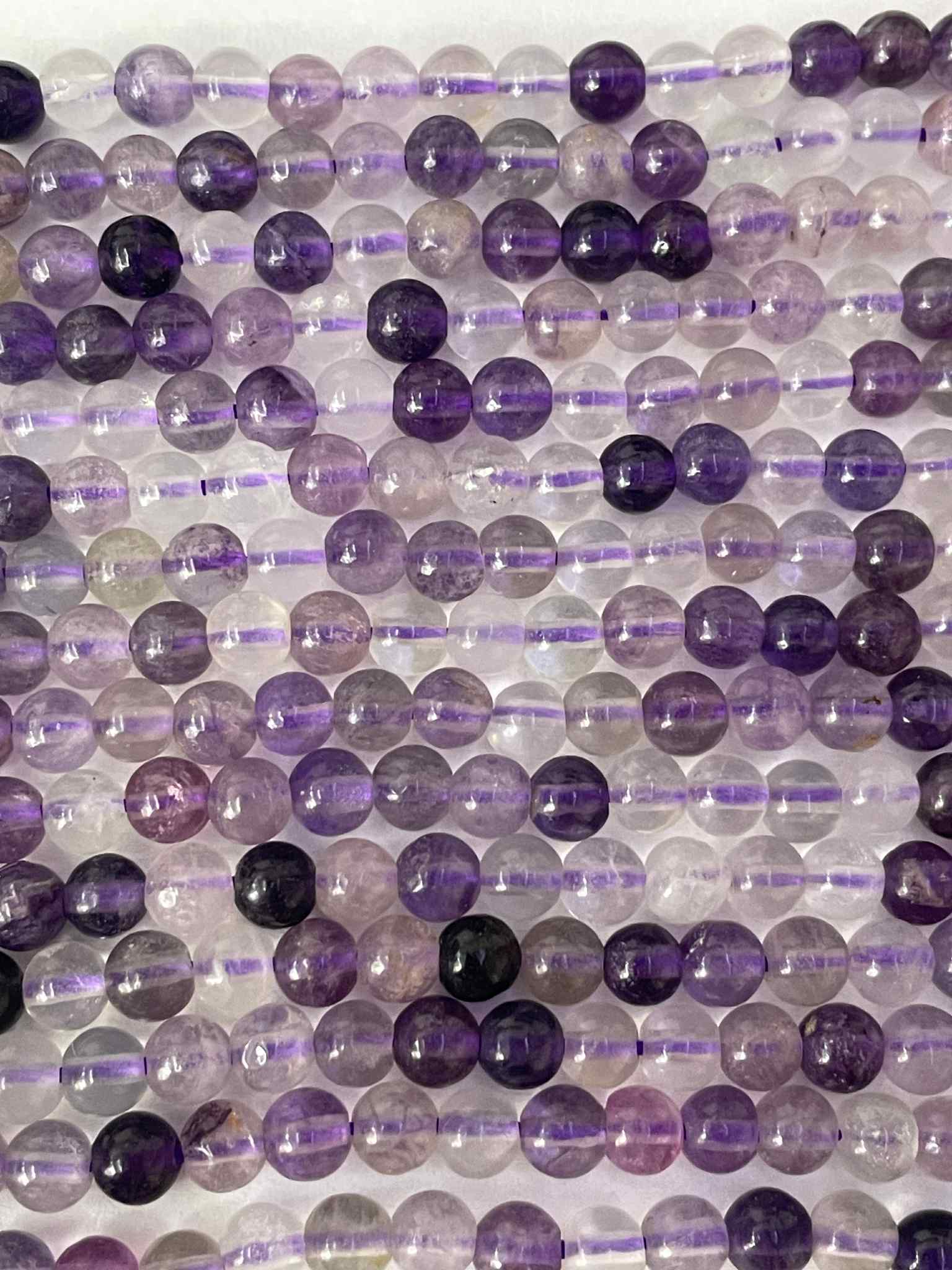 Regenbogen Fluorit 10mm LILA