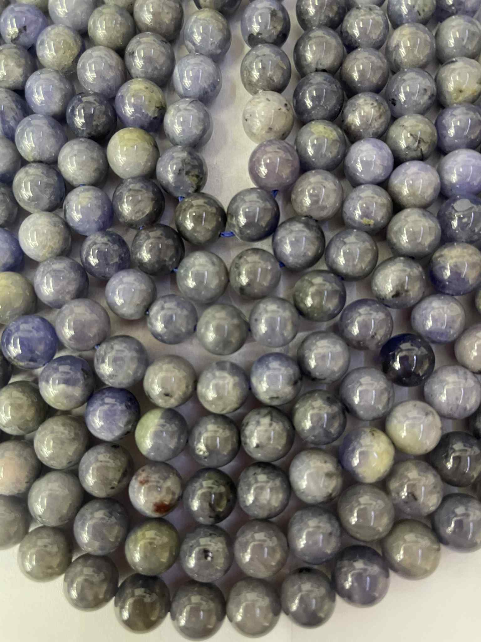 Fil de perles en tanzanite env. 8 mm – qualité rare – origine : Tanzanie