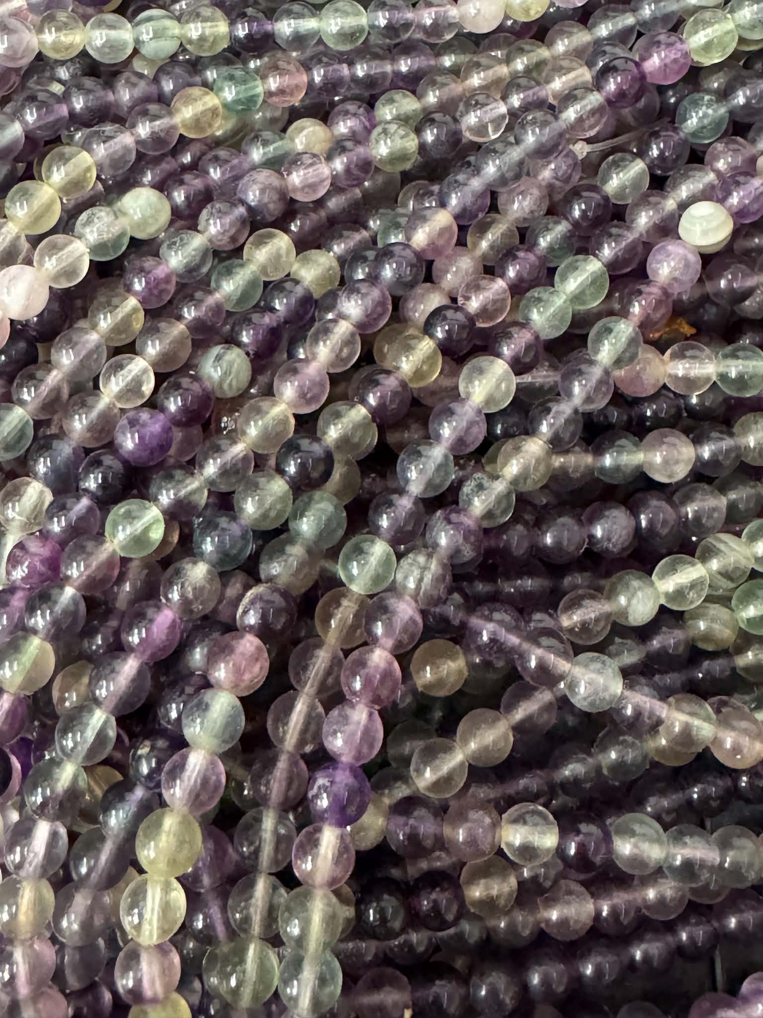 Fluorite foncée, fil de perles rondes env. 6,5 mm