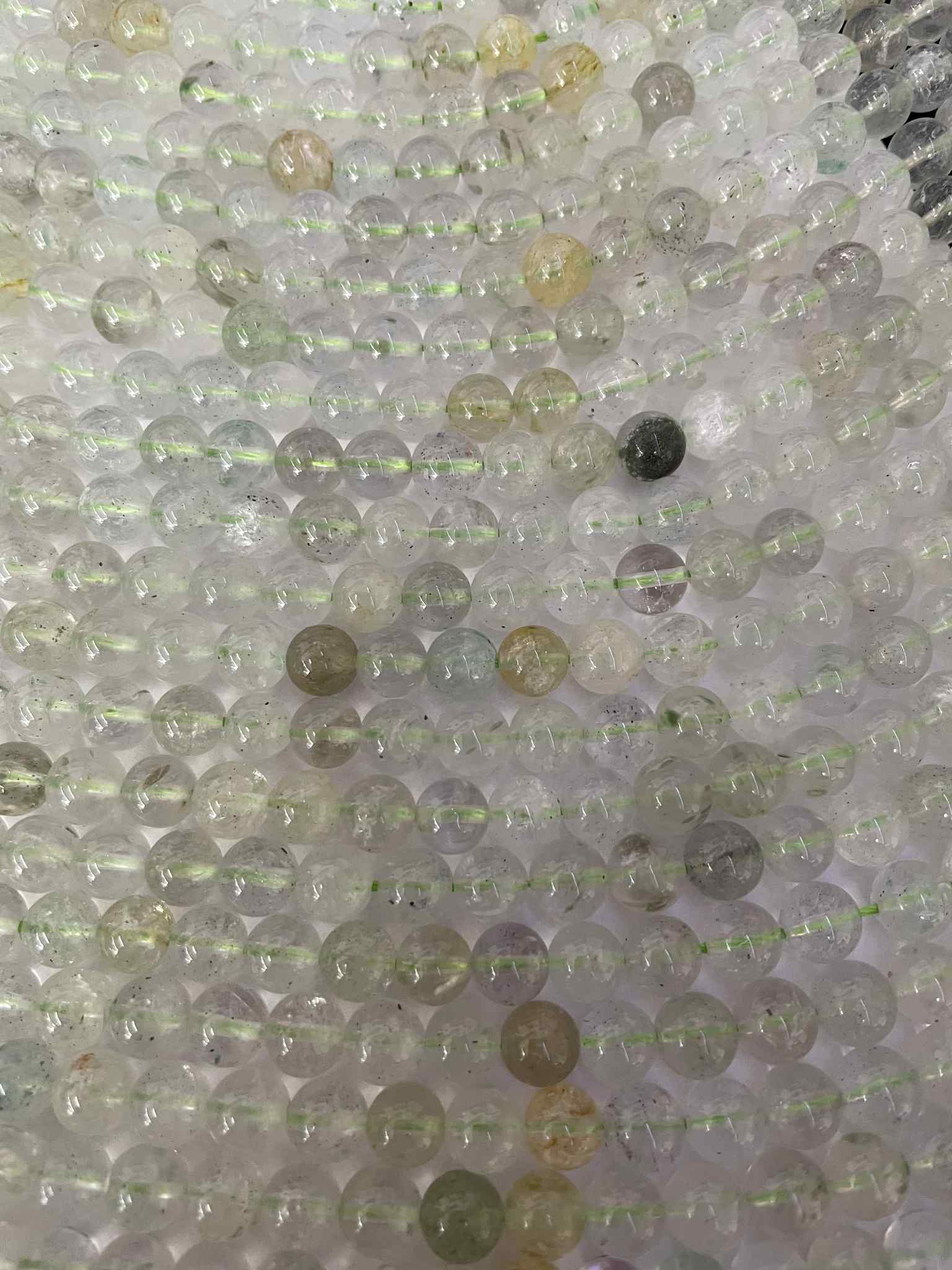 Grüner Beryll Kugelstrang ca. 8 mm – Probeschliff