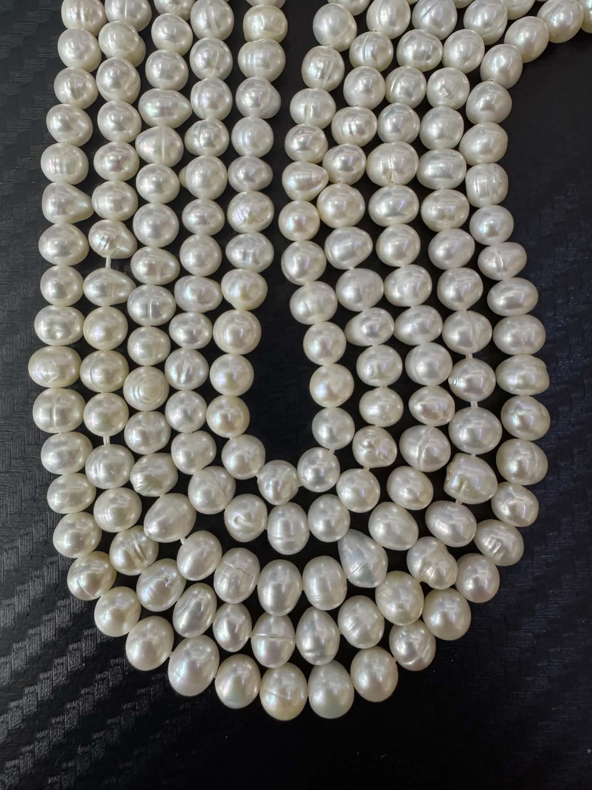 Perlenstrang weiss oval ca. 5.5mm