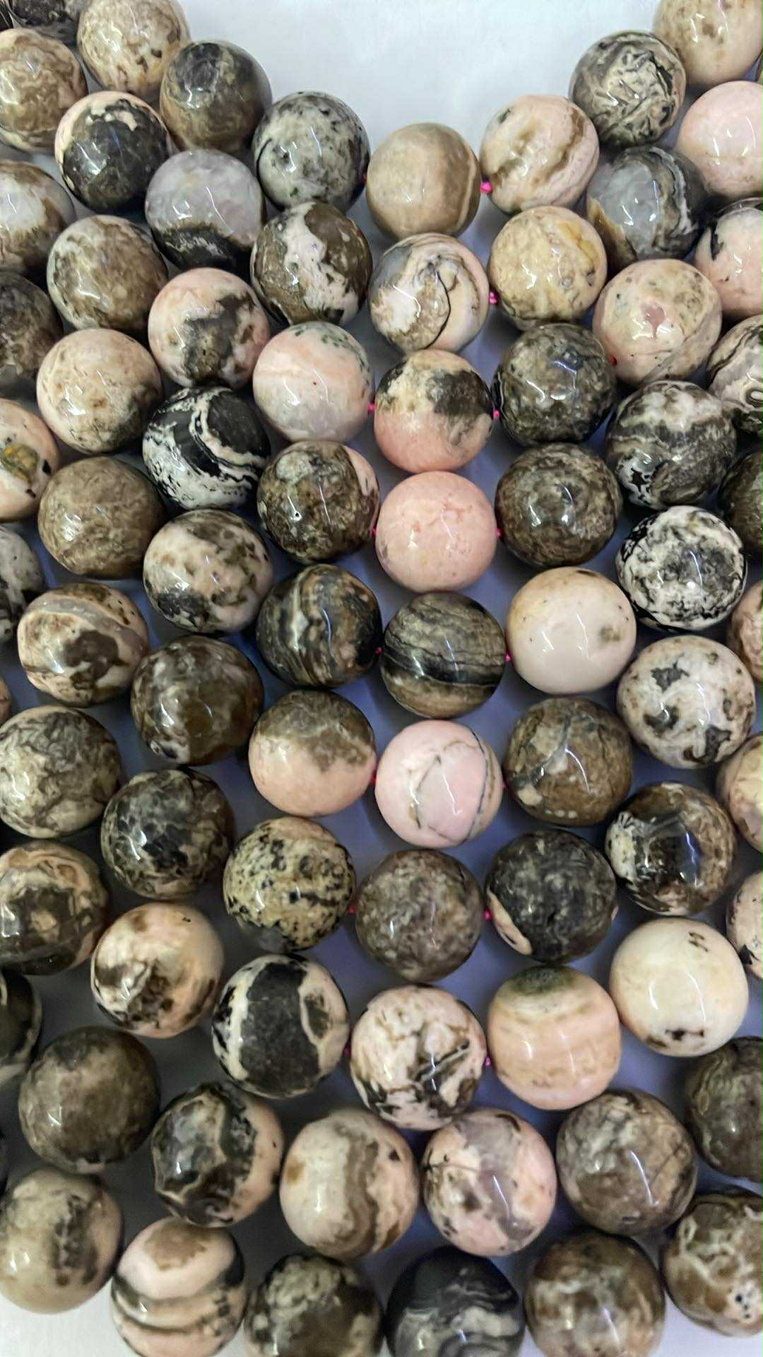 Fil de perles en rhodonite env. 10 mm – qualité supérieure – origine : Argentine
