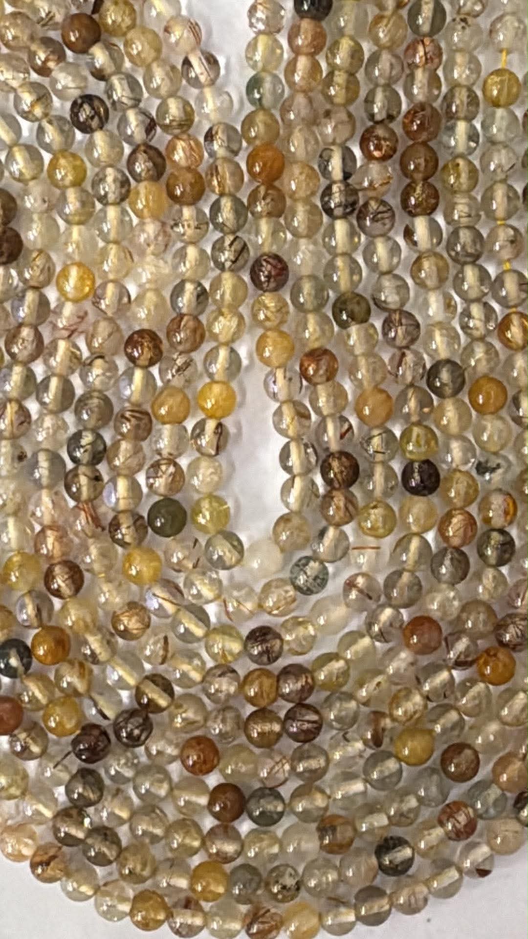Quartz rutile, fil de perles rondes 4 mm, mélange