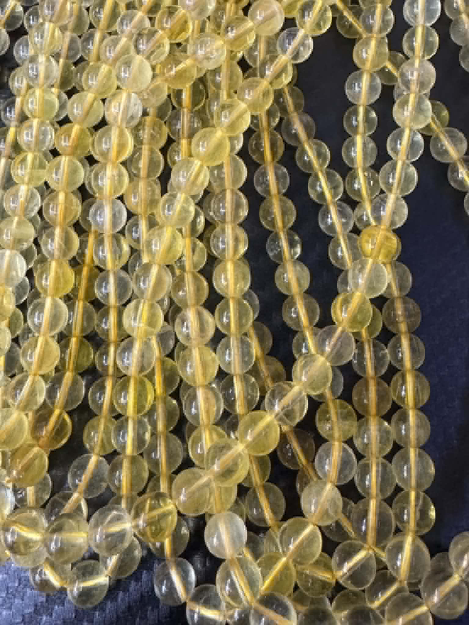 Fluorite jaune, fil de perles rondes env. 6 mm